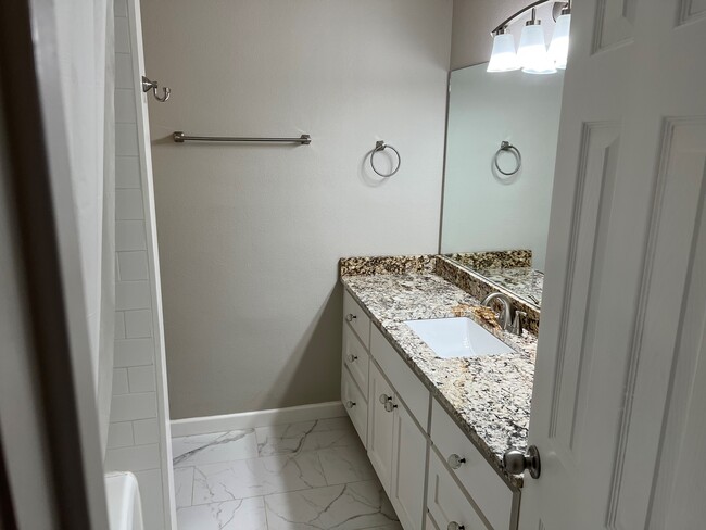 Full bathroom with lots of storage - 703 Sinclair Ave