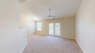 Located in Allison Park, PA, this well-designed single-floor, three-bedroom, two-bathroom home offers a comfortable and functional layout. The bright living room serves as the heart of the home, featuring soft carpeting, a ceiling fan, a pendant light fixture, and French doors that open onto a private balcony, allowing natural light to fill the space and providing pleasant outdoor views.

The kitchen is efficiently designed with light wood cabinetry, granite-look countertops, a full suite of white appliances including a range, built-in microwave, dishwasher, and refrigerator, and stone-tile flooring. A peninsula with a breakfast bar connects the kitchen seamlessly to the living area.

The spacious primary bedroom includes a ceiling fan, plush carpeting, and its own French door access. The two additional bedrooms are comfortably sized with soft carpet, natural light from windows with outdoor greenery views, and convenient closet access. Five closets throughout the home provide generous storage.

Both bathrooms feature stone-tile flooring, white vanities with mirrors, and clean, neutral finishes. One bathroom includes a shower stall. A dedicated utility room and a connecting hallway complete the thoughtful floor plan, making this home a practical and inviting residence.