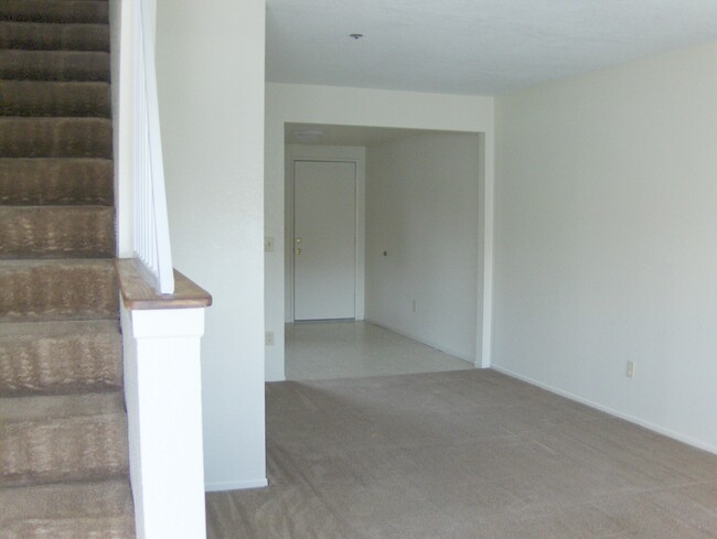 Entry view of Living Room and Kitchen - Desert Rose Apartments