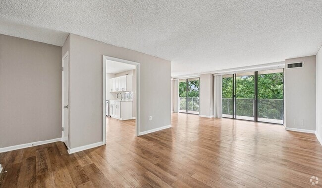 Open concept layout with spacious living room - The Summit
