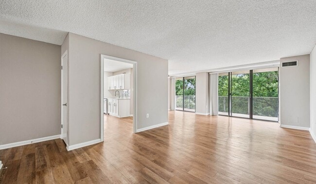 Open concept layout with spacious living room - The Summit
