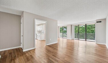 Open concept layout with spacious living room - The Summit