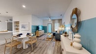 Located at 9005 Solay Rd in Winter Garden, FL, this thoughtfully designed single-floor residence offers 2 bedrooms and 2 bathrooms within a comfortable and efficiently laid-out floor plan. Wood-look flooring flows throughout the home, creating a cohesive and contemporary aesthetic.

The open living and dining area serves as the heart of the home, featuring a striking teal accent wall that extends partway up the white upper walls, a ceiling fan, and a welcoming atmosphere with access to natural light through multiple windows.

The kitchen is outfitted with crisp white shaker cabinetry, black hardware accents, stainless steel appliances including a range, microwave, and refrigerator, light quartz countertops, a tile backsplash, a built-in wine rack, and a kitchen island — delivering a clean, functional workspace.

The primary bedroom features a bold teal accent wall, while the secondary bedroom is wrapped in a lush botanical wallpaper, giving each room a distinct and curated character. The primary bathroom includes a soaking tub, glass-enclosed shower, a wood-toned double vanity, and direct access to a walk-in closet. The second bathroom offers a tub-shower combination and a clean, streamlined vanity. Together, these spaces offer a well-balanced and visually engaging home in the heart of Winter Garden.
