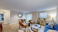 Embrace the opportunity to elevate your living experience in this beautifully designed 870 sq ft home. The spacious primary bedroom, measuring 200 sq ft, serves as your personal sanctuary, offering ample space for relaxation and rejuvenation. The home's open concept living area is a testament to contemporary design, featuring a stunning blue sofa that anchors the space, complemented by stylish leather accent chairs. Natural light floods the room through large windows, creating an ambiance of warmth and tranquility.

The kitchen, though compact, is a model of efficiency with modern appliances and ample storage, perfect for culinary enthusiasts. Both bathrooms showcase a blend of functionality and style, with wooden vanities and contemporary fixtures that add a touch of elegance to your daily routine.

Each of the three bedrooms is thoughtfully designed, with the primary bedroom boasting plush carpeting and a serene color palette that promotes restful nights. The home's cohesive design aesthetic, featuring a harmonious blend of blues, whites, and natural wood tones, creates a soothing atmosphere throughout.

Located in the desirable Belcamp area, this home at 1302 Liriope Ct offers not just a place to live, but a lifestyle to embrace. With its single-story layout and modern amenities, it's an ideal choice for those seeking comfort, style, and convenience. Don't miss this opportunity to make your dream home a reality.