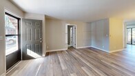 Located at 230 Pinecrest Dr in Fayetteville, NC, this well-appointed 2-bedroom, 2-bathroom single-story home offers a thoughtfully designed layout across a comfortable footprint. The open living and dining area features light-toned luxury vinyl plank flooring, neutral walls, and a classic chandelier, creating a bright and welcoming atmosphere with natural light from large windows.

The kitchen is a standout feature, showcasing white shaker cabinetry, marble-look countertops, a subway tile backsplash, and stainless steel appliances including an electric range — all complemented by the same LVP flooring that flows throughout the main living areas.

Both bedrooms are carpeted for comfort and offer generous natural light through windows with outdoor views. The primary bedroom provides a well-sized retreat, while a second bedroom serves equally well for guests or a home office. Four closets throughout the home ensure ample storage.

The bathrooms are clean and functional, featuring a full tub and shower combination with chrome fixtures. A dedicated laundry room includes overhead white cabinetry and washer/dryer connections for added convenience. The home also includes a private patio, perfect for outdoor relaxation.