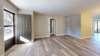 Located at 230 Pinecrest Dr in Fayetteville, NC, this well-appointed 2-bedroom, 2-bathroom single-story home offers a thoughtfully designed layout across a comfortable footprint. The open living and dining area features light-toned luxury vinyl plank flooring, neutral walls, and a classic chandelier, creating a bright and welcoming atmosphere with natural light from large windows.

The kitchen is a standout feature, showcasing white shaker cabinetry, marble-look countertops, a subway tile backsplash, and stainless steel appliances including an electric range — all complemented by the same LVP flooring that flows throughout the main living areas.

Both bedrooms are carpeted for comfort and offer generous natural light through windows with outdoor views. The primary bedroom provides a well-sized retreat, while a second bedroom serves equally well for guests or a home office. Four closets throughout the home ensure ample storage.

The bathrooms are clean and functional, featuring a full tub and shower combination with chrome fixtures. A dedicated laundry room includes overhead white cabinetry and washer/dryer connections for added convenience. The home also includes a private patio, perfect for outdoor relaxation.