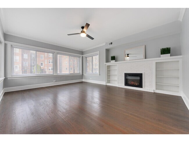 Living Room with built in quartz fireplace, plenty of natural light - 2745 W Winnemac Ave