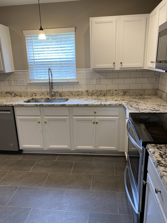 Newly remodeled kitchen with granite counters & stainless steel appliances. Refrigerator included. - 3817 Parkers Ferry Rd