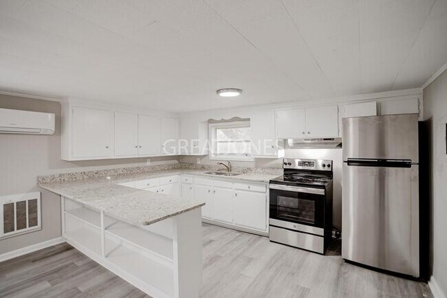 Building Photo - NOW OFFERING HALF OFF THE FIRST FULL MONTH...