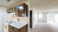 Located at 3620 N Academy Blvd in Colorado Springs, CO, this single-floor, three-bedroom, two-bathroom unit offers a practical and comfortable layout. The galley-style kitchen features dark espresso cabinetry with ample upper and lower storage, white countertops, a double-basin sink, and white appliances including an electric range and refrigerator, all set on easy-care light wood-style flooring. The kitchen opens toward the living area, which transitions seamlessly into carpeted spaces throughout. The spacious primary bedroom offers generous square footage, a walk-in closet with built-in shelving and hanging rods, and a large window with vertical blinds that brings in natural light. The additional bedrooms are also carpeted and well-lit with windows. A ceiling fan with a light fixture is featured in one of the rooms alongside a mix of laminate and carpet flooring. The two full bathrooms each include a tub and shower combination — one with classic white square tile surround and the other with a molded white surround. Textured ceilings are consistent throughout the unit, adding a classic residential character. The overall ambiance is clean, neutral, and move-in ready, offering a comfortable living environment in a convenient Colorado Springs location.