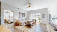 Located at 680 S Calhoun Pl in Star, Idaho, this single-story home offers a thoughtfully designed open-concept layout with a cohesive, modern aesthetic. Light hardwood flooring flows throughout the main living areas, complemented by soft neutral tones on the walls that enhance the sense of brightness and openness.

The living room is a welcoming centerpiece, featuring a ceiling fan, multiple windows that invite an abundance of natural light, and ample space for comfortable seating. The kitchen is well-appointed with sleek gray cabinetry, white quartz countertops, stainless steel appliances, a subway tile backsplash, and pendant lighting above a peninsula with bar seating — ideal for both everyday cooking and casual entertaining. An adjacent dining area provides a dedicated space for sit-down meals.

The bedroom features plush carpet, large windows with views of the outdoors, and a serene, restful atmosphere. The bathroom mirrors the home's refined style, showcasing a wide vanity with gray cabinetry, a white quartz countertop, and a natural light-filled window.

Throughout the home, consistent design choices — including modern fixtures, clean lines, and a warm neutral palette — create a cohesive and inviting living environment well-suited to everyday comfort.