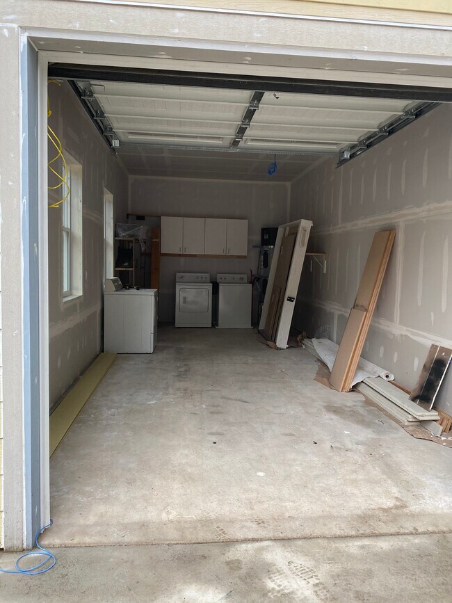 Huge, separate one bay garage high ceiling. Picture during construction. - 1090 Kitsap Lake Rd NW