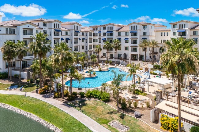Resort-style pool, spa, and waterfront lounge areas. - 2511 W Queen Creek Rd