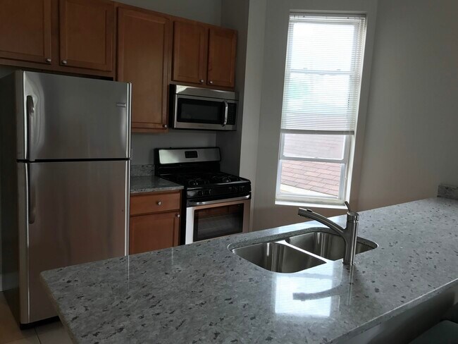 Kitchen with stainless steel appliances - 2608 W Evergreen Ave