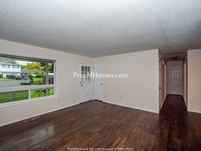 Building Photo - Charming Updated Three Bedroom Home In Bea...