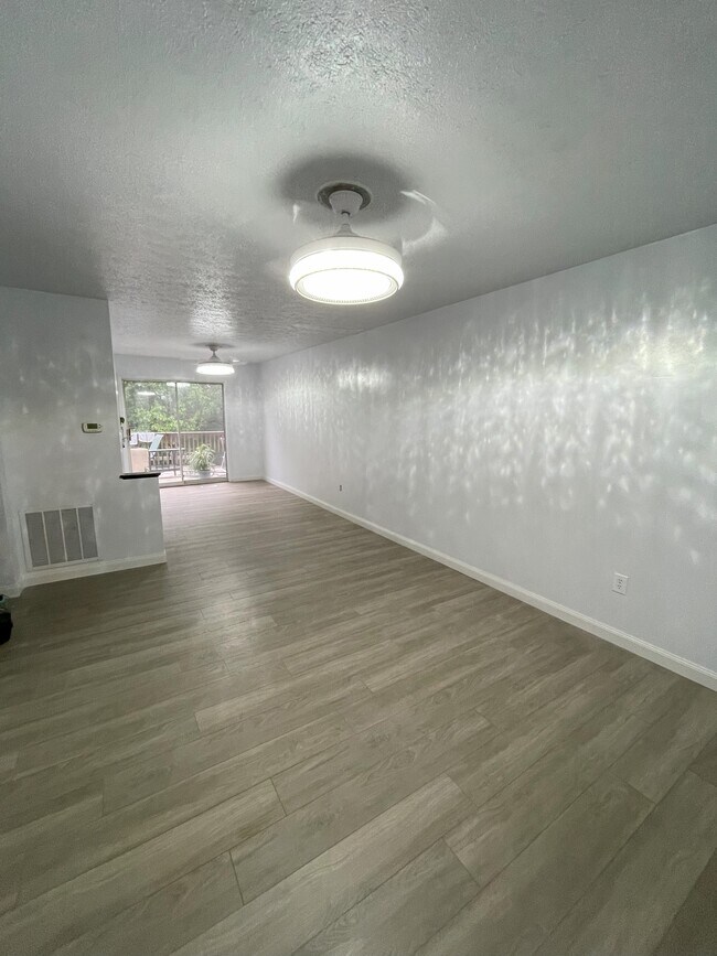 Full picture of living room and dining room together - 672 Chester Ave Townhome