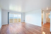 Located at 365 Talbot Ave in Pacifica, CA, this well-appointed 1-bedroom, 2-bathroom single-floor residence offers a bright, open layout with stunning Pacific Ocean views. Warm hardwood flooring flows throughout, unifying each room with a clean, cohesive aesthetic.

The combined dining and living area is generously proportioned, bathed in natural light, and anchored by sliding glass doors that open to a private patio — framing sweeping ocean vistas. The galley-style kitchen is thoughtfully designed with white shaker cabinetry, quartz countertops, stainless steel appliances including a refrigerator, range, microwave, and dishwasher, plus a stainless steel sink.

The spacious primary bedroom features a mirrored sliding-door closet and a large window with direct ocean views, lending it a serene, light-filled character. Three closets total provide ample storage throughout the home. The primary bathroom offers a dual-sink vanity with quartz countertops and white cabinetry, while the second bathroom includes a full bathtub with shower. A hallway connects the spaces efficiently, completing this thoughtfully laid-out coastal residence.