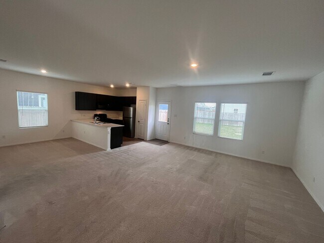 Building Photo - 2023 4 bed 2.5 bath with a fenced in backyard and attached garage