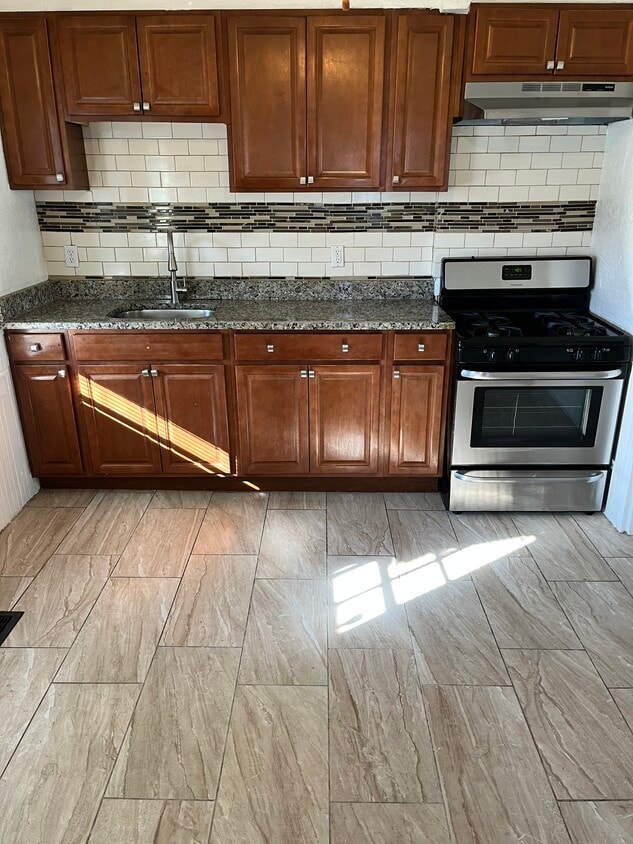 Granite Countertops, Stainless Steel Stove and Range Hood - 52 Germain Ave
