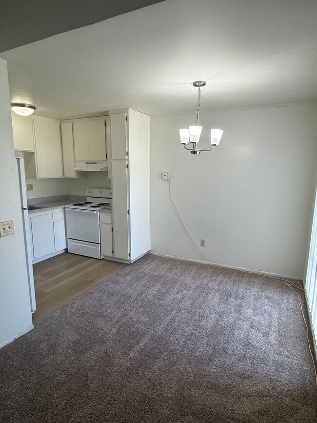 Building Photo - Upstairs two-bedroom 1/12 bath condo avail...
