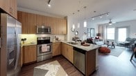 This 1-bedroom, 1-bathroom A3 floor plan delivers a thoughtfully designed single-level living experience with modern finishes and an inviting open-concept layout. The living area features rich wood-look flooring, a ceiling fan, and large windows that allow natural light to fill the space, creating a bright and welcoming atmosphere. The kitchen is a standout, outfitted with warm wood cabinetry, granite countertops, a subway tile backsplash, and a full suite of stainless steel appliances including a side-by-side refrigerator, electric range, built-in microwave, and dishwasher. Track and pendant lighting illuminate the space beautifully, while a peninsula counter offers additional prep space and a seamless connection to the living area. An entryway nook with a granite ledge provides a practical transition from the front door into the home. The bedroom is a serene retreat with plush carpet, a ceiling fan, and a generous window dressed with blinds and curtains. The bathroom features a long granite-topped vanity with ample wood cabinetry, a large mirror, wood-look flooring, and a tub and shower combination with tile surround, offering both style and practicality.
