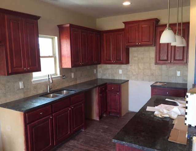 Upgrade kitchen with Cabernet Cherry wood cabinets. ( New pictures are coming with appliances!) - 4917 Sanger Circle