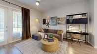 Located in Clermont, FL, this well-appointed one-bedroom, one-bathroom residence offers a thoughtfully designed open-concept floor plan that maximizes every inch of its comfortable footprint. The kitchen is a standout feature, boasting white shaker cabinetry, stainless steel appliances, a tiled backsplash, granite countertops, and a central island with bar seating illuminated by sleek pendant lighting — ideal for both cooking and casual dining. The adjacent dining area flows seamlessly into the living room, which is bright and welcoming, featuring wood-look flooring, a ceiling fan, and French doors that open onto a screened patio overlooking lush green outdoor surroundings. The bedroom is a peaceful retreat with elevated ceilings, a large window allowing generous natural light, and direct access to a dedicated walk-in closet with built-in shelving for ample storage. The bathroom is finished with floor-to-ceiling tile, a glass-enclosed walk-in shower, and clean modern fixtures. Throughout the residence, neutral tones and consistent wood-look flooring create a cohesive, contemporary aesthetic. The private screened patio provides a relaxing outdoor escape with open views of the surrounding landscape.