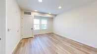 Located at 301 Station Dr in Dublin, PA, this 1-bedroom, 1-bathroom residence offers a thoughtfully designed single-level layout with modern finishes throughout. The open-concept kitchen and living area serves as the heart of the home, showcasing granite countertops, crisp white shaker cabinetry, stainless steel appliances including a refrigerator with ice maker, electric range, microwave, and dishwasher, all illuminated by stylish pendant lighting. Light wood-tone flooring runs throughout the main living areas, lending a clean and contemporary feel. The living area is bright and open, with windows that invite natural light and outdoor views. The bedroom is a comfortable retreat featuring plush carpeting, dual windows with outdoor views, and ample space for furnishings. A dedicated closet provides convenient storage. The full bathroom is finished in neutral tones with a tub/shower combo, a vanity with a marble-style countertop, and recessed lighting. A dedicated laundry area houses a stacked full-size washer and dryer for added convenience. The overall ambiance is fresh, modern, and move-in ready, offering a practical yet refined living experience.