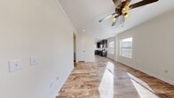 This 770 square foot home in Huntsville, AL offers a practical and modern living space. The single-story layout includes two bedrooms and two bathrooms, providing efficient use of space. The primary bedroom, measuring 130 square feet, offers ample room for comfort.

Throughout the home, durable wood-look flooring creates a cohesive and low-maintenance aesthetic. Large windows in the bedrooms and living areas flood the space with natural light, enhancing the overall ambiance. The kitchen showcases rich, dark wood cabinetry contrasted by light countertops and stainless steel appliances, including a refrigerator, stove, and built-in microwave.

Both bathrooms feature clean, white fixtures and tiled surroundings. One bathroom includes a shower/tub combination, while the other offers a standalone shower with glass doors. The dedicated laundry area with a top-loading washer adds convenience to daily living.

The home's neutral color palette and simple design allow for personalization while maintaining a modern feel. With its efficient layout and thoughtful amenities, this property offers comfortable living in a compact footprint.