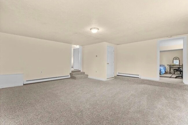 Living area - fresh wall to wall carpet - 333 Groveland St