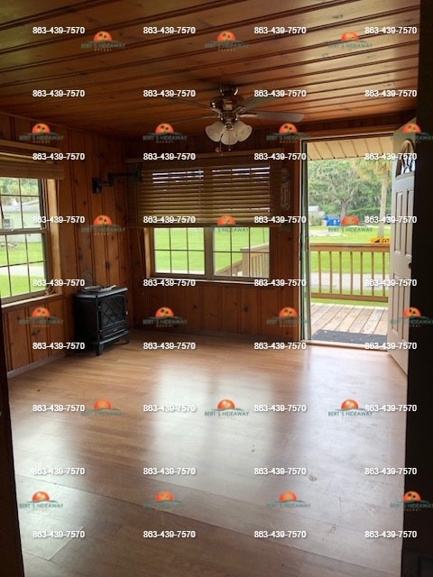 Livingroom with knotty pine walls and ceiling - 2854 Tindel Camp Rd
