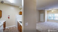 Located at 820 Martin Luther King Jr Pkwy in Durham, NC, this one-bedroom, one-bathroom residence offers a well-organized single-floor layout designed for comfortable everyday living. The open-concept area seamlessly combines the living room, dining room, and kitchen, creating a cohesive and functional shared space. The kitchen features warm wood-toned cabinetry, a double sink with light countertops, and white appliances, with durable hard-surface flooring underfoot. The living area is generously proportioned, highlighted by notably high ceilings and ceiling fans that enhance airflow and openness. Soft carpeting and neutral beige walls create a warm, inviting ambiance, while a window at the far end fills the room with natural light and views of the surrounding greenery. The bedroom is a comfortable, private retreat with plush carpeting, high ceilings, and a window that brings in natural light. Two closets provide ample storage throughout the unit. The bathroom is cleanly appointed with wood-look flooring, a vanity with warm cabinetry, and a tub-shower combination. A utility room and hallway round out the layout, adding practical functionality. The overall design is straightforward, neutral, and move-in ready.