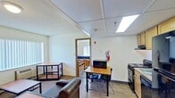 Located at 646 East College Avenue in State College, PA, this compact 390-square-foot, one-bedroom, one-bathroom apartment on the fourth floor offers a practical and functional layout well-suited for student living. The unit is organized across a single floor, encompassing a living room, a 130-square-foot bedroom, a closet, and a full bathroom.

The living room features wood-style flooring, a window with vertical blinds that allows natural light in, a wall-mounted HVAC unit, and baseboard heating. The space is designed to accommodate seating and study areas.

The bedroom is carpeted and includes a large window with vertical blinds, providing natural light and outdoor views. The room is sized to comfortably fit two twin beds with built-in dresser storage, along with a dedicated study desk and chair — a functional setup for student occupants.

The bathroom is outfitted with a full tub-and-shower combination featuring a curtain rod, alongside a toilet and standard fixtures, all finished in clean white tones with light wood-accented cabinetry.

The unit also includes a closet area adjacent to the main living space. With its efficient use of space and proximity to Penn State's campus on College Avenue, this apartment is a practical option for students seeking convenient off-campus housing.