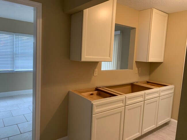 Kitchen- new cabinets. Granite countertops to be installed next week. - 1055 Greco Rd