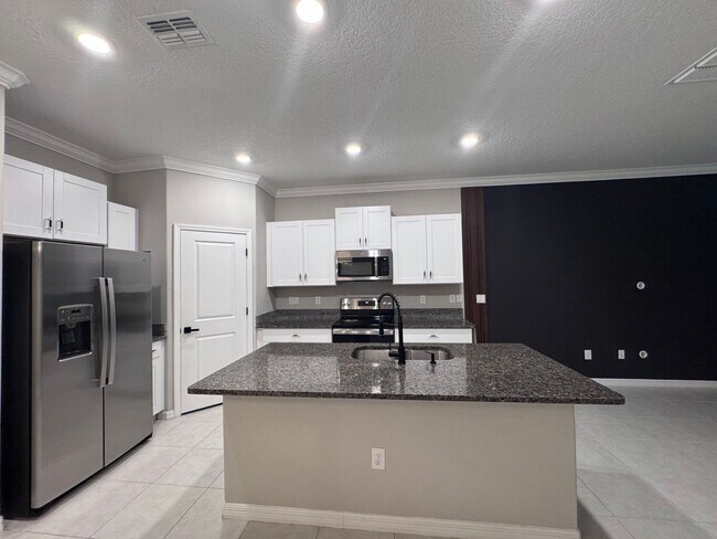 Building Photo - Upgraded Townhome Steps from Wesley Chapel...
