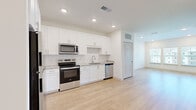 Located at 1485 Fouraker Rd in Jacksonville, FL, this well-appointed one-bedroom, one-bathroom unit offers a thoughtfully designed single-floor layout. The open-concept living area seamlessly connects the kitchen, dining, and living spaces, creating a bright and functional environment. Large windows flood the living room with natural light, offering views of the surrounding community.

The kitchen is a standout feature, showcasing crisp white shaker cabinetry, granite countertops, a classic subway tile backsplash, and a full suite of stainless steel appliances including an electric range, microwave, dishwasher, and refrigerator. Light hardwood-style flooring runs throughout the main living areas, complementing the clean, modern aesthetic.

The bedroom is a comfortable retreat with plush carpeting, a ceiling fan, and a window that allows for natural light. A dedicated closet provides practical storage. The bathroom features a full tub-shower combination with white subway tile surround, granite-topped vanity with white cabinetry, and coordinating hardware. A dedicated laundry area adds everyday convenience. Throughout the unit, recessed lighting, neutral tones, and clean finishes create a cohesive, move-in-ready atmosphere.