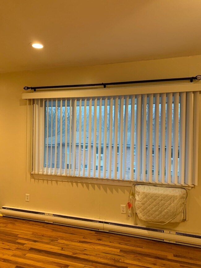 Living Room showing A/C unit - 1660 Farmington Ave