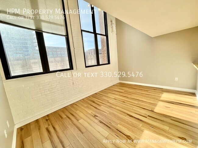 Building Photo - Water Street Apartments - first month rent...