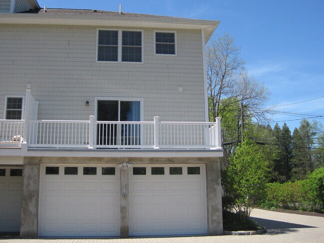 Exterior of unit with garage and balcony deck - 24 North St