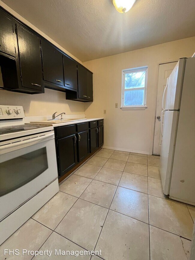 Foto del edificio - 2 br, 1 bath House - 919 N Fulbright Ave