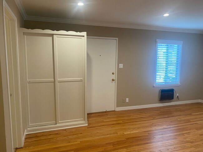 LIVING ROOM WITH BUILT IN WARDROBE CLOSET - 3017 W Riverside Dr