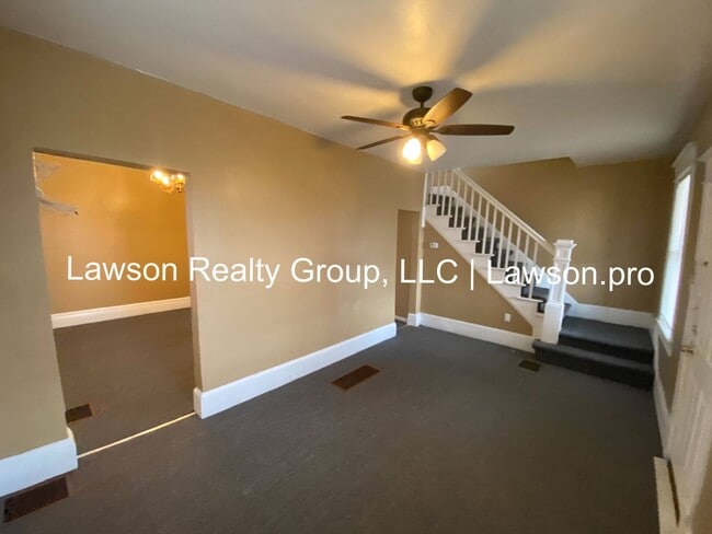 Building Photo - Updated Three Bedroom with Flat Yard