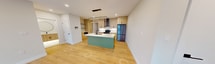 This contemporary 1100 square foot apartment in London, Ontario, boasts a thoughtful layout with 2 bedrooms and 2 bathrooms. The space is characterized by its abundance of natural light, courtesy of expansive floor-to-ceiling windows that offer picturesque city views. The open-concept living area seamlessly integrates the kitchen, dining, and living spaces, creating a fluid and spacious atmosphere.

The kitchen is a standout feature, showcasing modern light wood cabinetry, contrasting with a unique mint-green island. High-end appliances and ample counter space make it ideal for culinary enthusiasts. Stylish lighting fixtures, including a distinctive oval-shaped pendant over the island, add a touch of sophistication.

Throughout the apartment, light wood flooring enhances the bright and airy feel. The bedrooms, including a 160 square foot primary suite, offer comfort and privacy. The bathrooms are elegantly appointed with contemporary fixtures, featuring terrazzo-style flooring and sleek vanities.

Storage is well-considered, with three closets and built-in shelving. The apartment also includes a balcony, perfect for enjoying outdoor views. Recessed lighting and neutral wall colors contribute to the overall modern aesthetic, creating a clean and inviting living space.