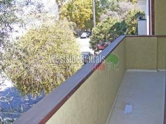 Big balcony overlooking tree lined street. - 12724 Caswell Ave