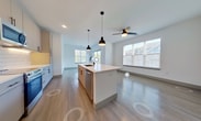 Step into a world of contemporary elegance and effortless living at Aura - 343 in North Chesterfield. This exquisite 1280 square foot single-story home is a testament to modern design and thoughtful craftsmanship. As you enter, you're greeted by an open-concept kitchen and living area that epitomizes urban sophistication. The kitchen, a culinary enthusiast's dream, boasts sleek cabinetry, state-of-the-art stainless steel appliances, and a striking subway tile backsplash, all illuminated by stylish pendant lighting.

The living space flows seamlessly from the kitchen, creating an ideal setting for both relaxation and entertainment. Large windows flood the area with natural light, while plush carpeting in the bedrooms adds a touch of luxury underfoot. The primary bedroom, a generous 140 square feet, offers a private retreat with ample space for a king-size bed and personal touches.

Each of the three bathrooms is a study in modern design, featuring elegant vanities, ample storage, and spa-like shower areas. The attention to detail is evident throughout, from the sleek hardware to the contemporary light fixtures. With three bedrooms and three full baths, this home provides the perfect balance of personal space and convenience for family living or hosting guests.

Embrace a lifestyle of comfort and style in this meticulously crafted home, where every element has been chosen to elevate your daily experience. Whether you're a young professional, a growing family, or someone who appreciates the finer things in life, this property at Aura - 343 is not just a home – it's a statement of your aspirations and a canvas for your dreams.
