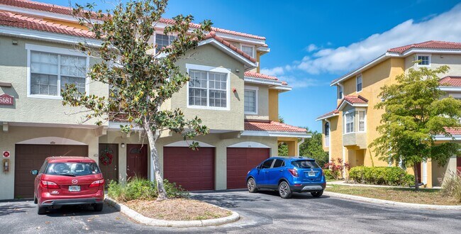 Front of Building - Garage and 1 parking space, additional parking spaces available - 5681 Bentgrass Dr Townhome