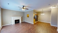 Located in Knoxville, TN, this two-story, 3-bedroom, 3-bathroom home offers a well-designed layout spread across two floors. The main level features a combined kitchen and living room area with rich hardwood flooring, crown molding, and a ceiling fan. A charming fireplace anchors the living space, while French doors invite natural light and provide outdoor access. A pass-through window connects the living and dining areas, adding a functional, open feel. The kitchen is well-appointed with light maple cabinetry, dark granite countertops, tile flooring, track lighting, and stainless steel appliances. An attached garage with an automatic opener and a built-in electrical panel completes the ground floor. Upstairs, three carpeted bedrooms each include dedicated closets with wire shelving systems, providing ample storage. The primary bedroom is generously sized with its own closet. Three full bathrooms are finished with tile flooring; one features a tub-shower combo. Six-panel interior doors are consistent throughout. Two staircases and well-connected hallways ensure smooth circulation between floors. Neutral warm-toned walls throughout create a cohesive and inviting atmosphere across the entire home.