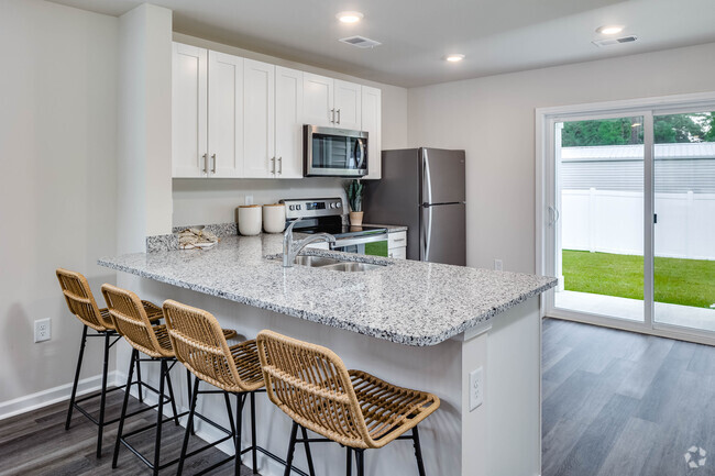 Kitchen from dining room. - Coastal Wind