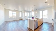 Located at 2820 Hibiscus Ave in Boulder, CO, this well-appointed 3-bedroom, 3-bathroom residence offers a thoughtfully designed single-level layout with modern finishes throughout. The open-concept living and kitchen area serves as the heart of the home, featuring rich hardwood-style flooring, recessed lighting, and an abundance of natural light streaming through large windows that frame stunning mountain views. The kitchen is a standout feature, equipped with warm wood cabinetry, stainless steel appliances including a refrigerator and microwave, a subway tile backsplash, and a spacious center island with a quartz countertop and pendant lighting overhead. The living area flows seamlessly to a private balcony, perfect for enjoying Boulder's scenic surroundings. The three bedrooms offer comfortable retreats, with the primary bedroom accessing the balcony directly. Secondary bedrooms feature plush carpeting and ample natural light. Five closets provide generous storage throughout. The bathrooms are elegantly finished with wood-toned vanities, quartz countertops, and tiled shower surrounds. A dedicated laundry room with a full-size washer and dryer, a pantry, and a utility room add practical convenience to this well-rounded home.