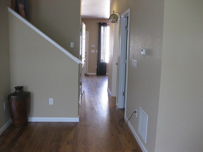 Hallway from entryway leading back to kitchen - 10257 E 31st Ave